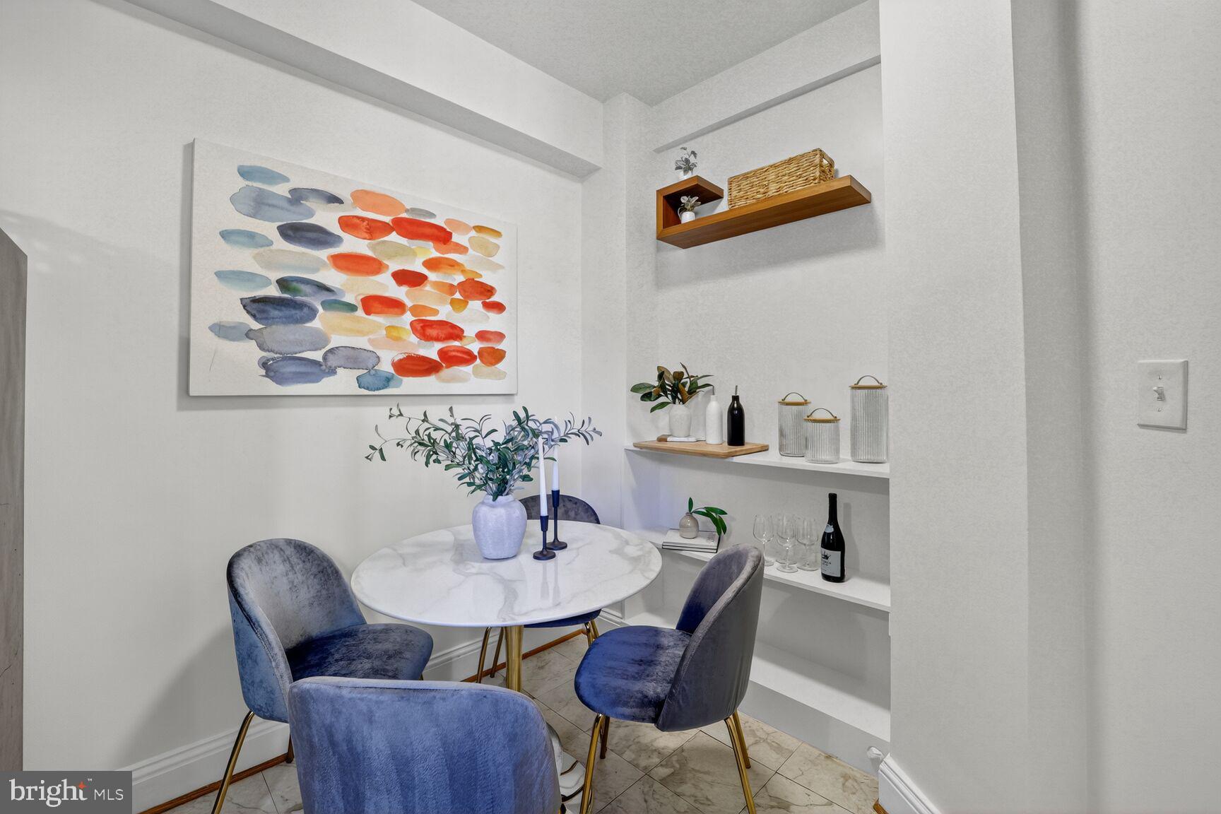 2707 Adams Mill Road Northwest, Unit 303 Washington, DC 20009 - Photo 13 of 27 a view of a dining room with furniture and wooden floor