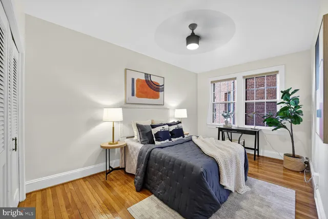 a bedroom with bed and a lamp