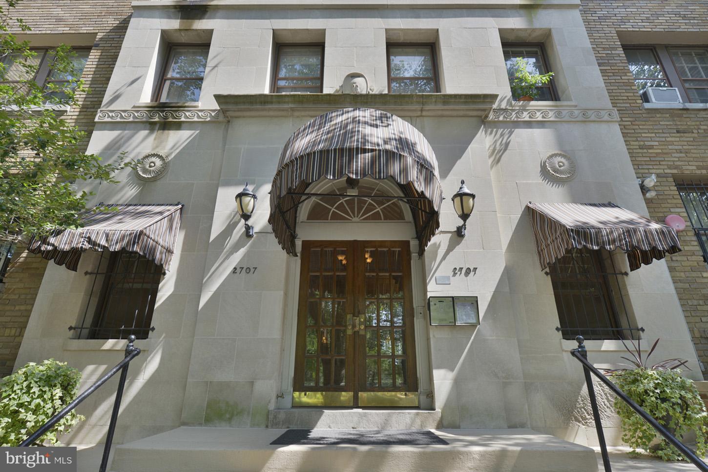 2707 Adams Mill Road Northwest, Unit 303 Washington, DC 20009 - Photo 2 of 27 an aerial view of a house with a swimming pool