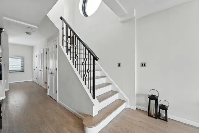 a view of a hallway with staircase