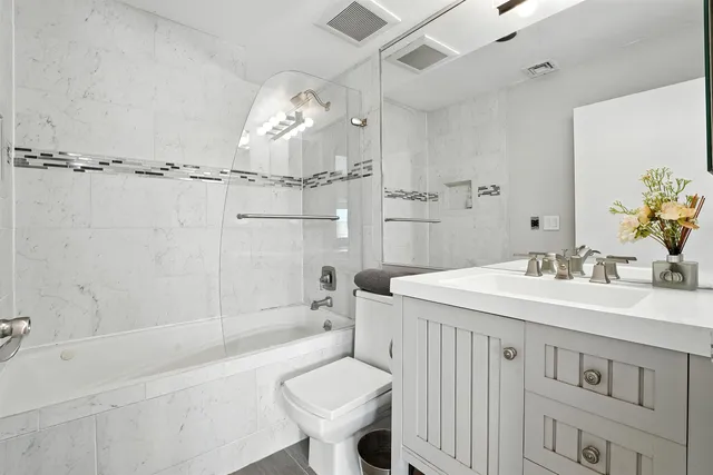 a bathroom with a sink toilet a shower and bathtub