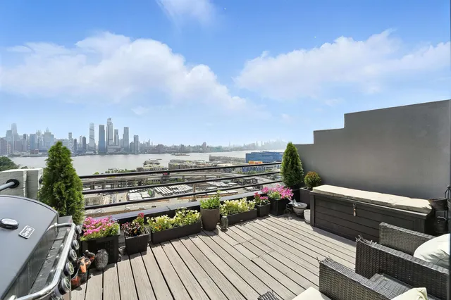 a view of a terrace with wooden benches