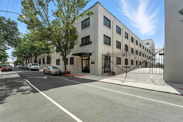 a view of a building along the street