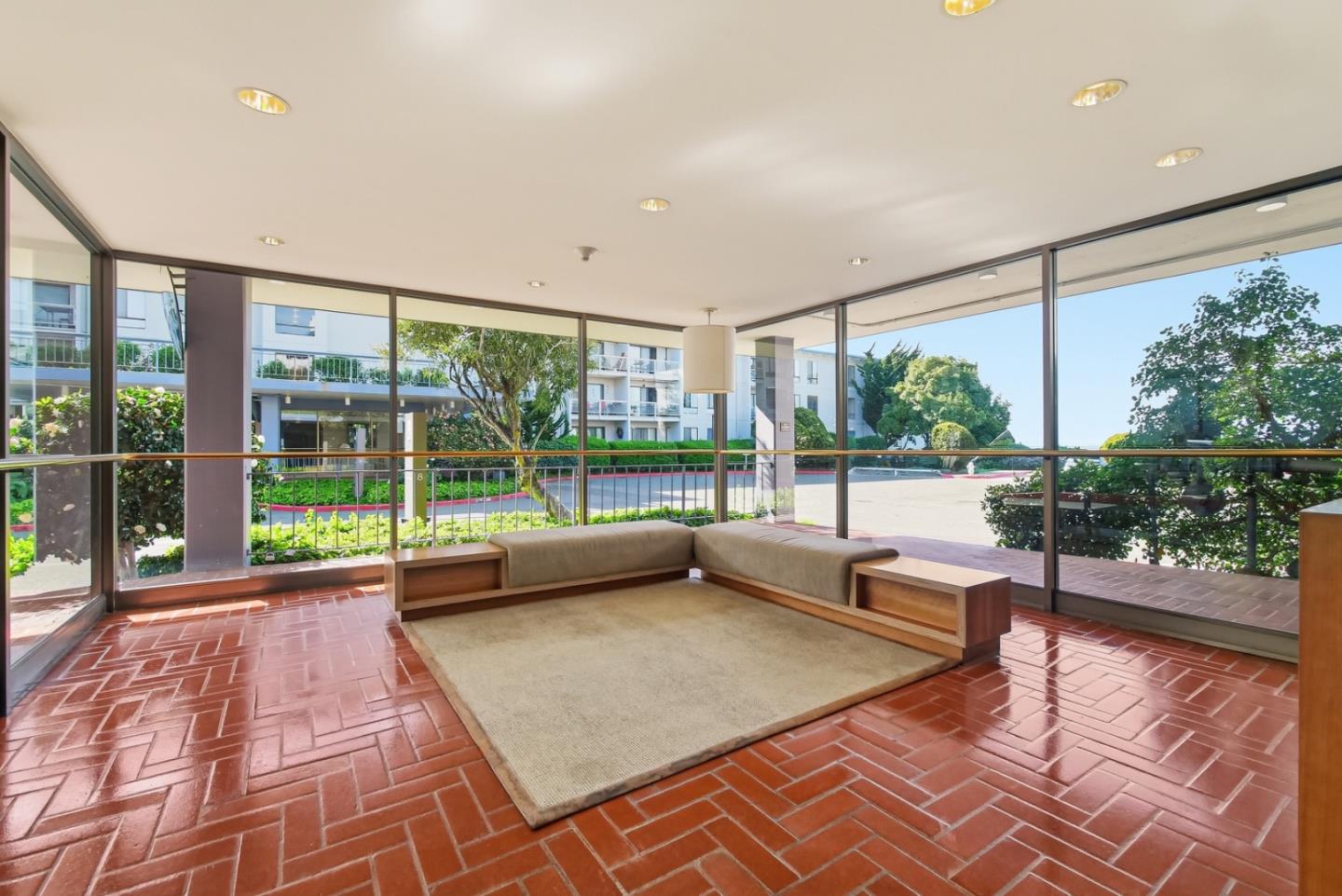 8 Commodore Drive, Unit C457 Emeryville, CA 94608 - Photo 23 of 48 a view of a living room with a floor to ceiling window and wooden floor
