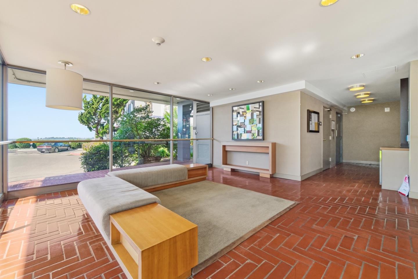 8 Commodore Drive, Unit C457 Emeryville, CA 94608 - Photo 24 of 48 a living room with a couch and a table