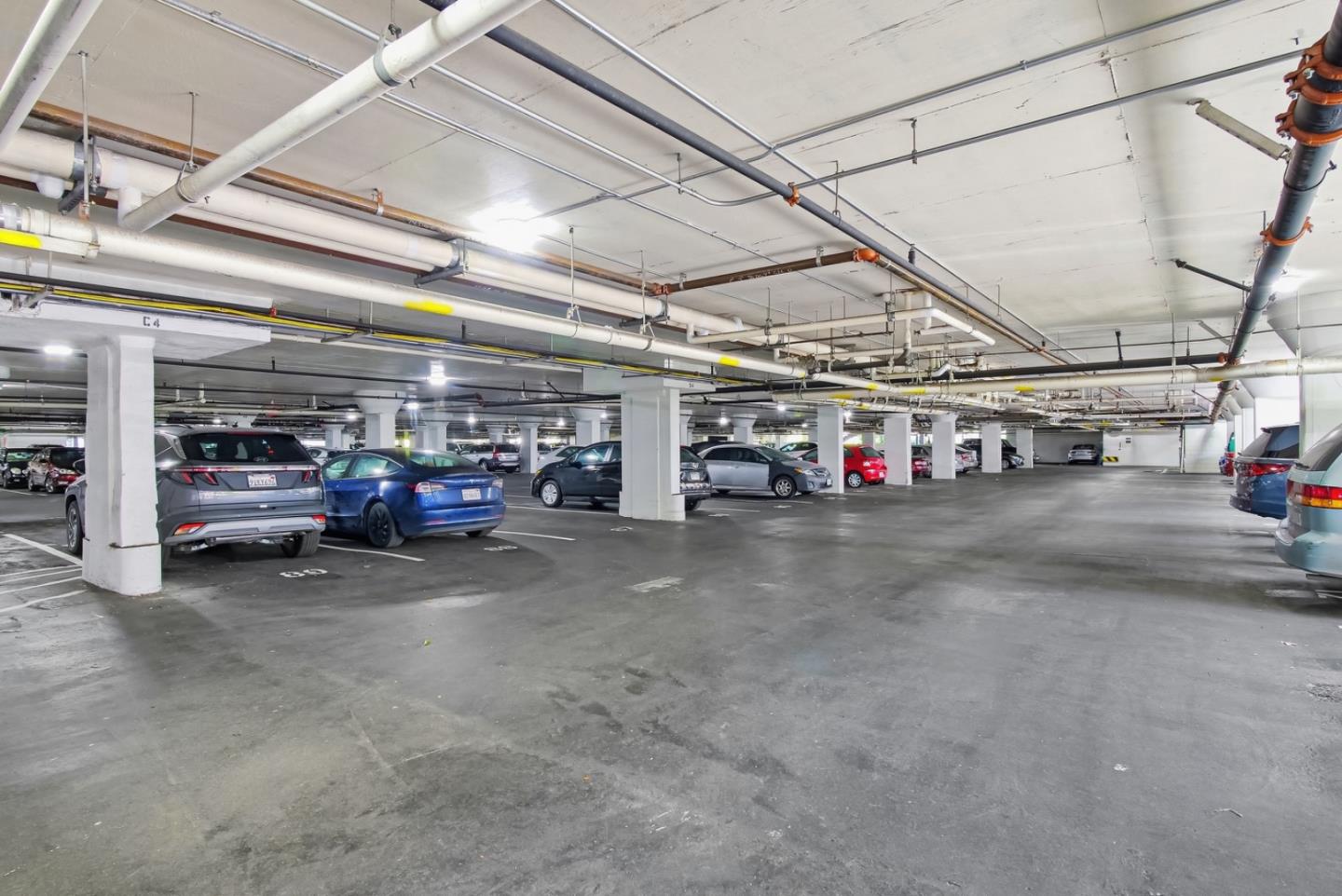 8 Commodore Drive, Unit C457 Emeryville, CA 94608 - Photo 28 of 48 a view of parking garage with cars