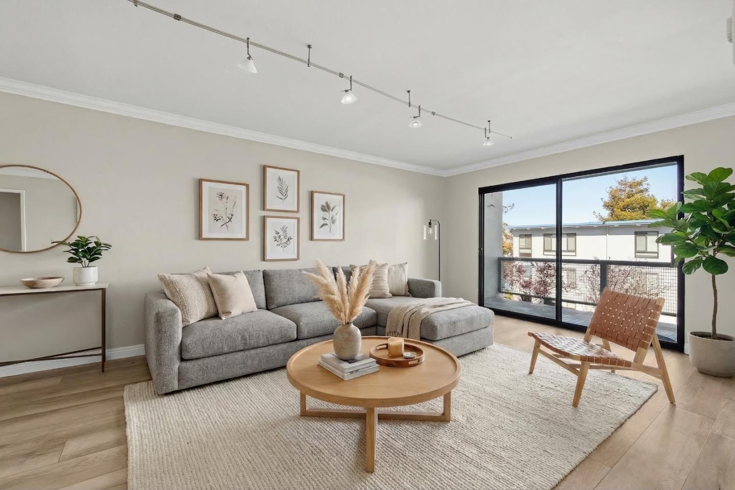 8 Commodore Drive, Unit C457 Emeryville, CA 94608 - Photo 3 of 48 a living room with furniture and a large window