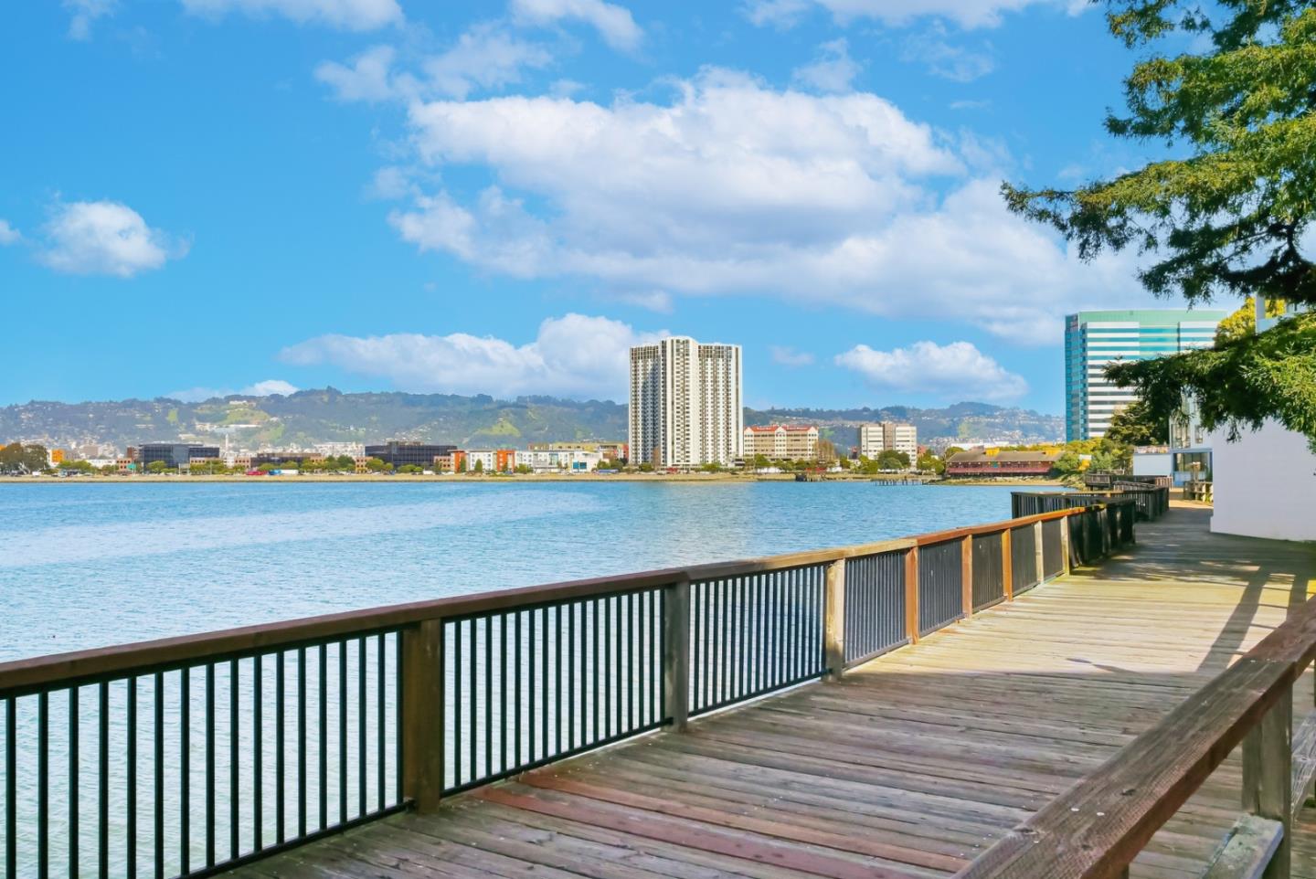8 Commodore Drive, Unit C457 Emeryville, CA 94608 - Photo 38 of 48 a view of a balcony with wooden floor and city view