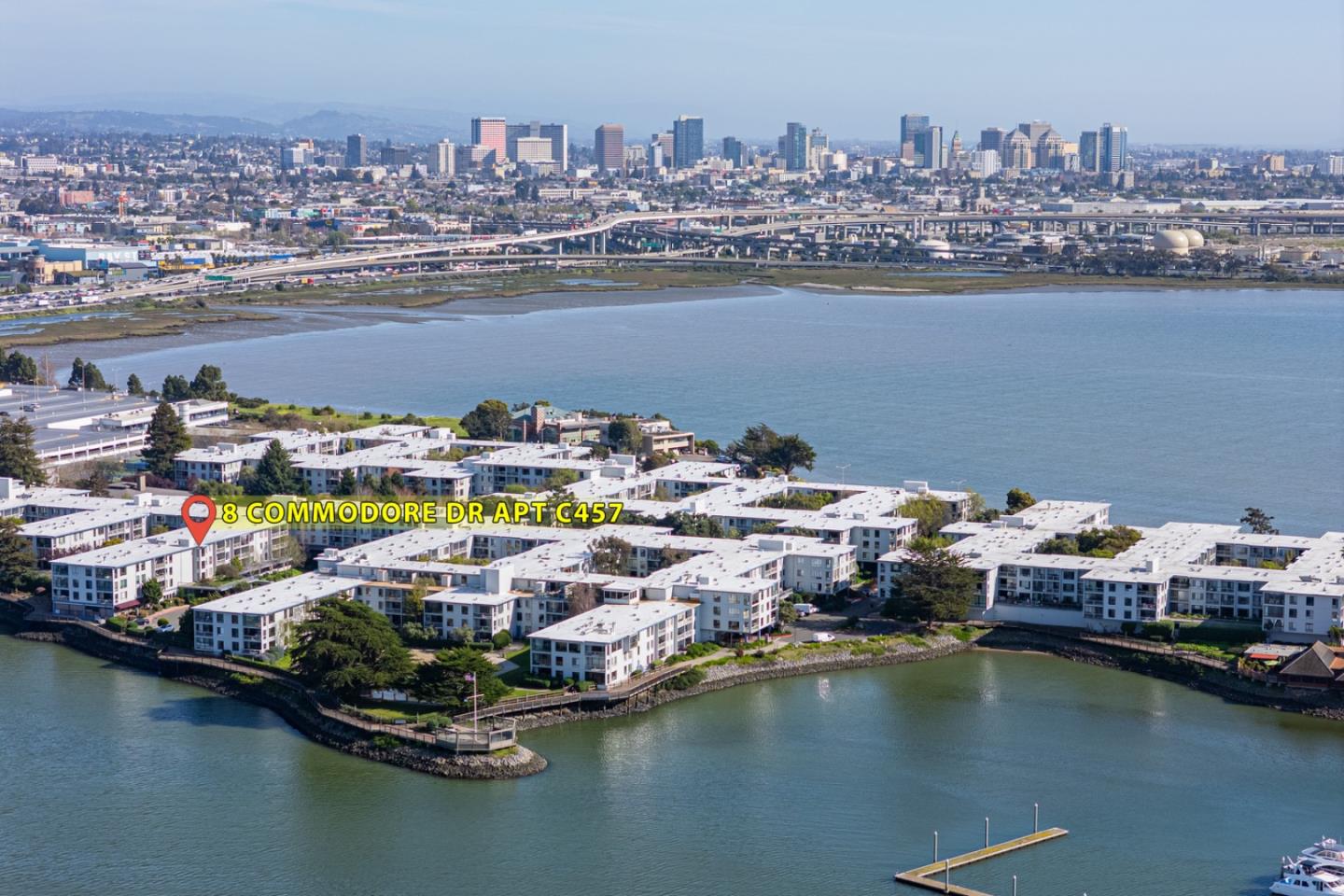 8 Commodore Drive, Unit C457 Emeryville, CA 94608 - Photo 42 of 48 a view of a lake with boats and trees in the background