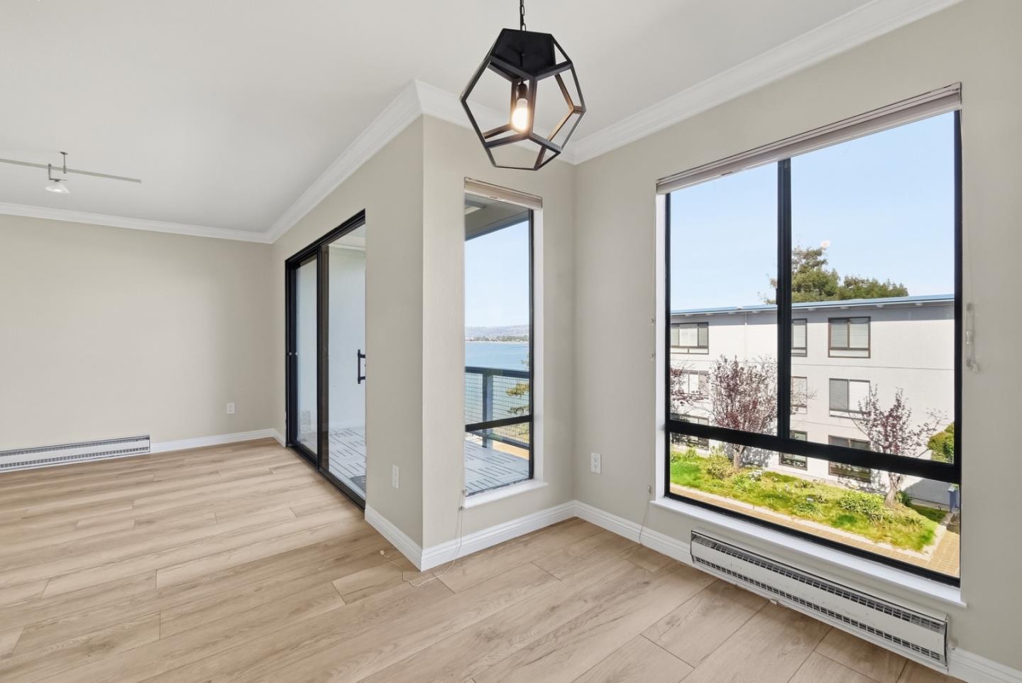 8 Commodore Drive, Unit C457 Emeryville, CA 94608 - Photo 10 of 48 wooden floor in an empty room with a window