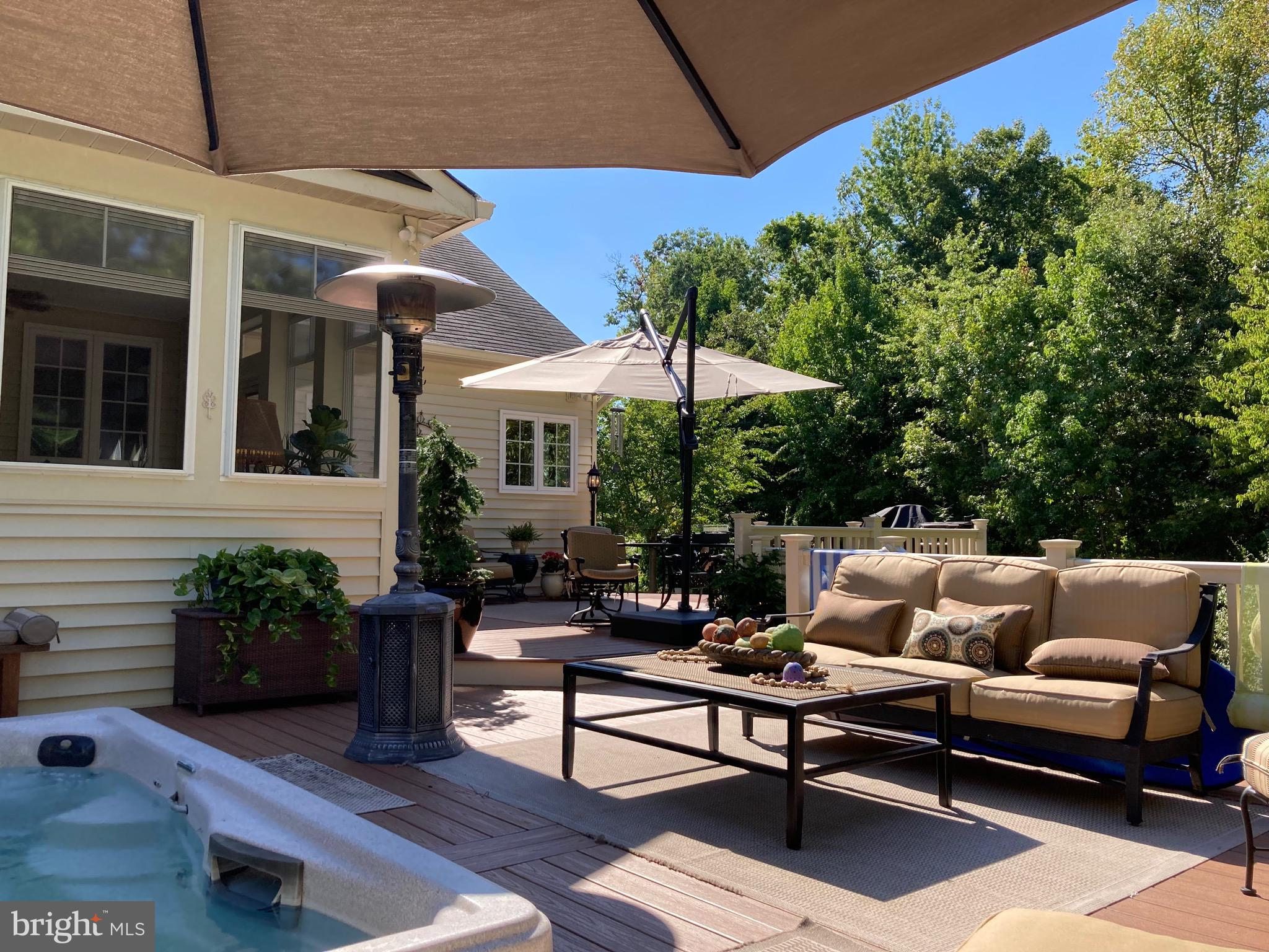 4590 Spring Run Road Warrenton, VA 20187 - Photo 77 of 80 a patio with patio a table and chairs under an umbrella