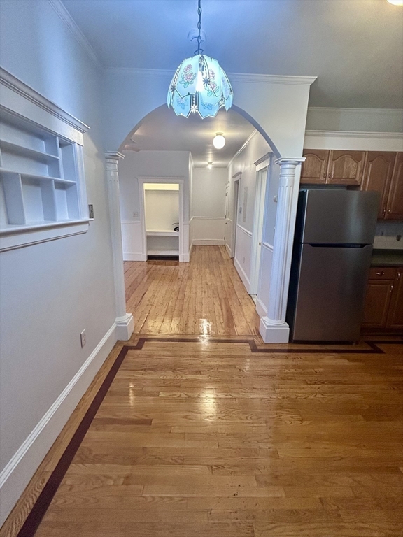 361 Adams Street, Unit 2 Boston, MA 02122 - Photo 3 of 9 a view of empty room with wooden floor