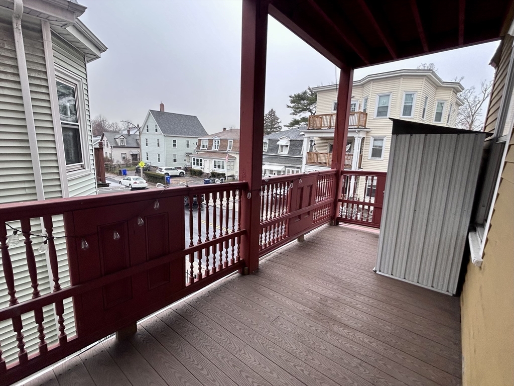 361 Adams Street, Unit 2 Boston, MA 02122 - Photo 8 of 9 a view of a balcony with wooden floor