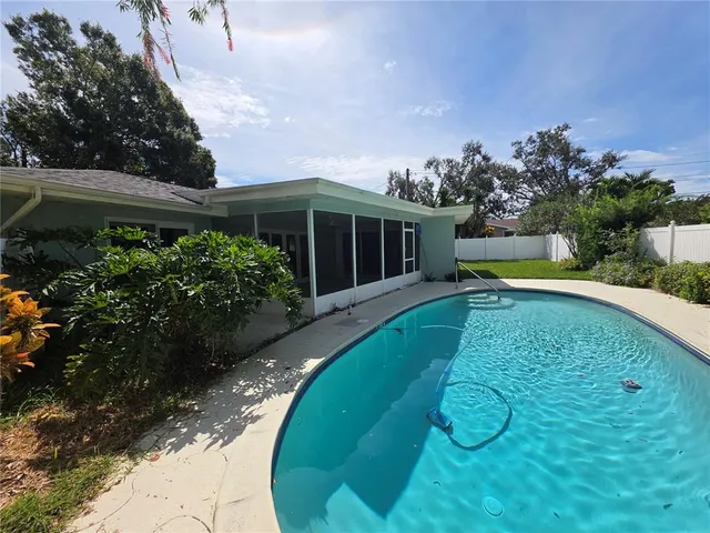 a view of a house with swimming pool