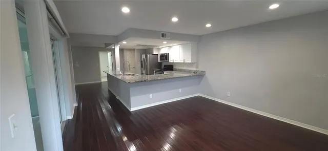 a view of a kitchen from the hallway