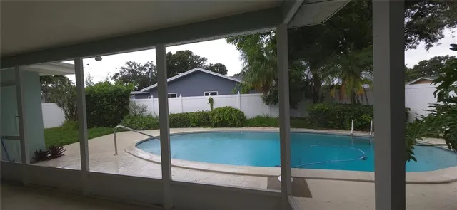 a view of a chair and table in the balcony