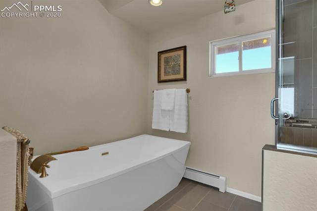 965 Bowstring Road Monument, CO 80132 - Photo 20 of 34 The master bath also has this large soaking tub for those days when when you need a long, soothing bath.