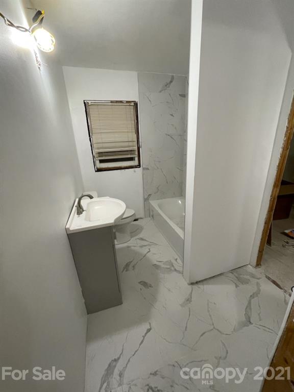 2121 North New Hope Road Gastonia, NC 28054 - Photo 11 of 11 a bathroom with a sink and mirror