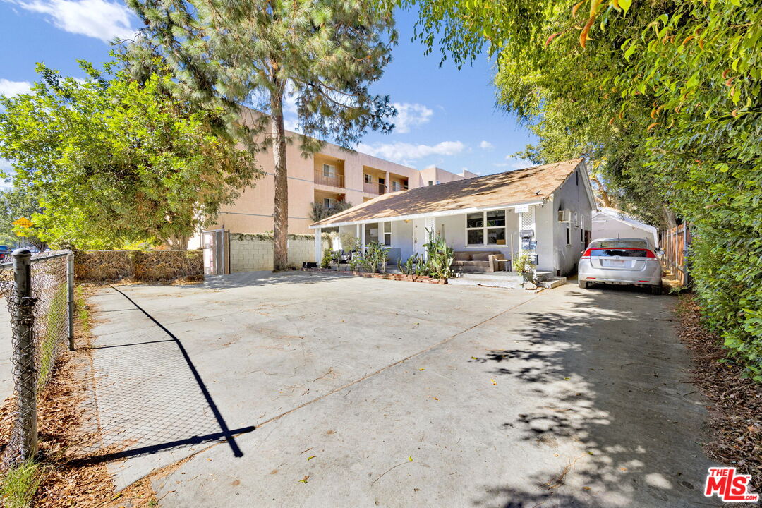 14541 Hart Street Van Nuys, CA 91405 - Photo 4 of 39 a city street lined with buildings and cars