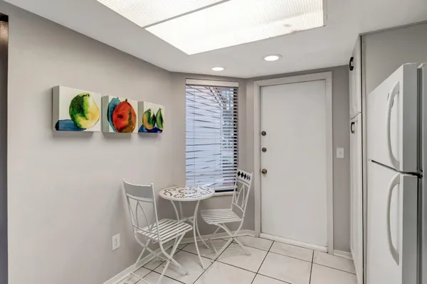 a bedroom with two beds and a large mirror