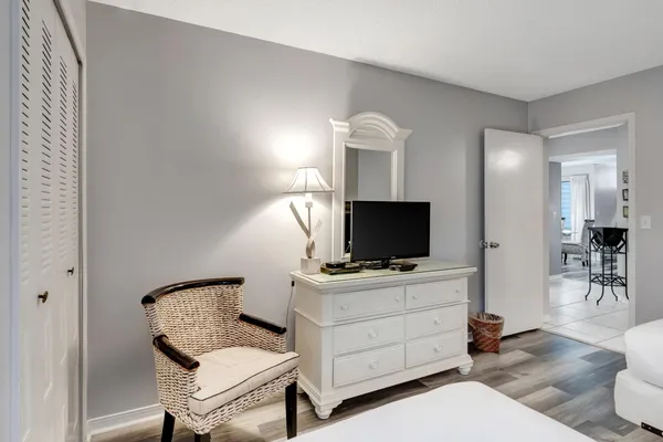 a bathroom with a bathtub shower sink vanity and toilet