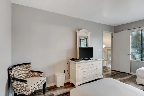 a spacious bathroom with a double vanity sink and a mirror