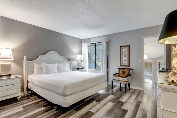 a spacious bathroom with a double vanity sink and a mirror
