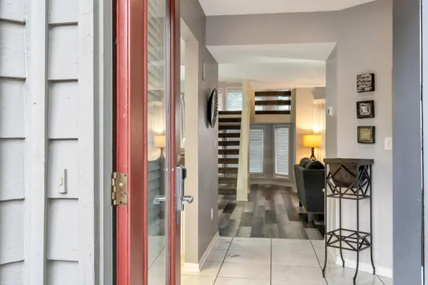 a kitchen with granite countertop a sink a stove and a refrigerator