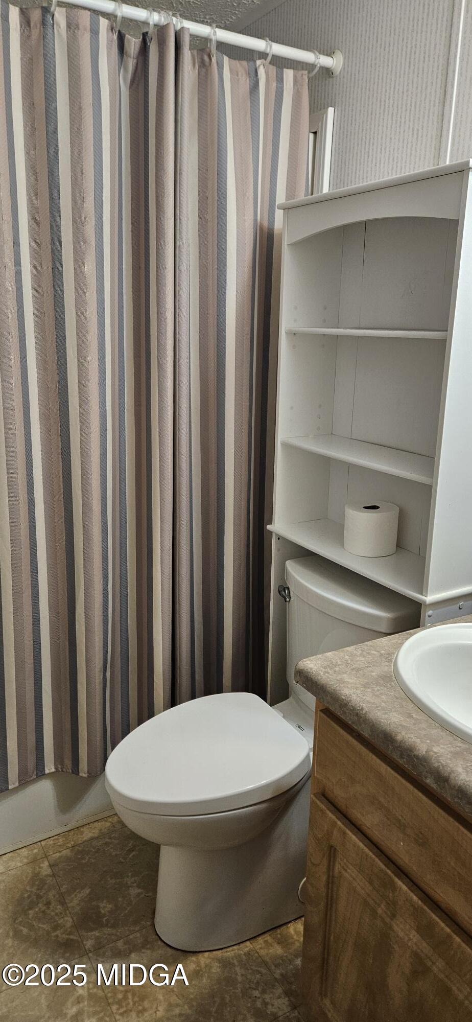 121 5 Points Road Gray, GA 31032 - Photo 18 of 20 a white toilet sitting next to a bathroom