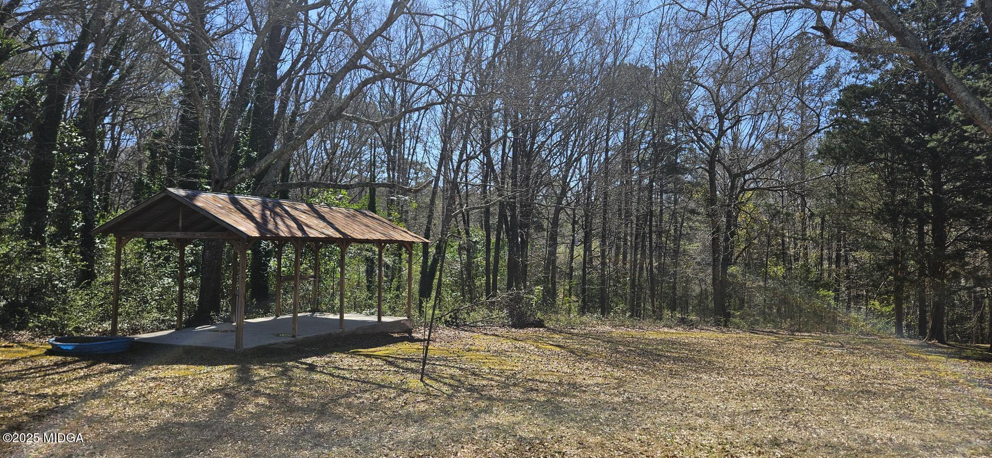 121 5 Points Road Gray, GA 31032 - Photo 4 of 20 a view of a backyard with a barn
