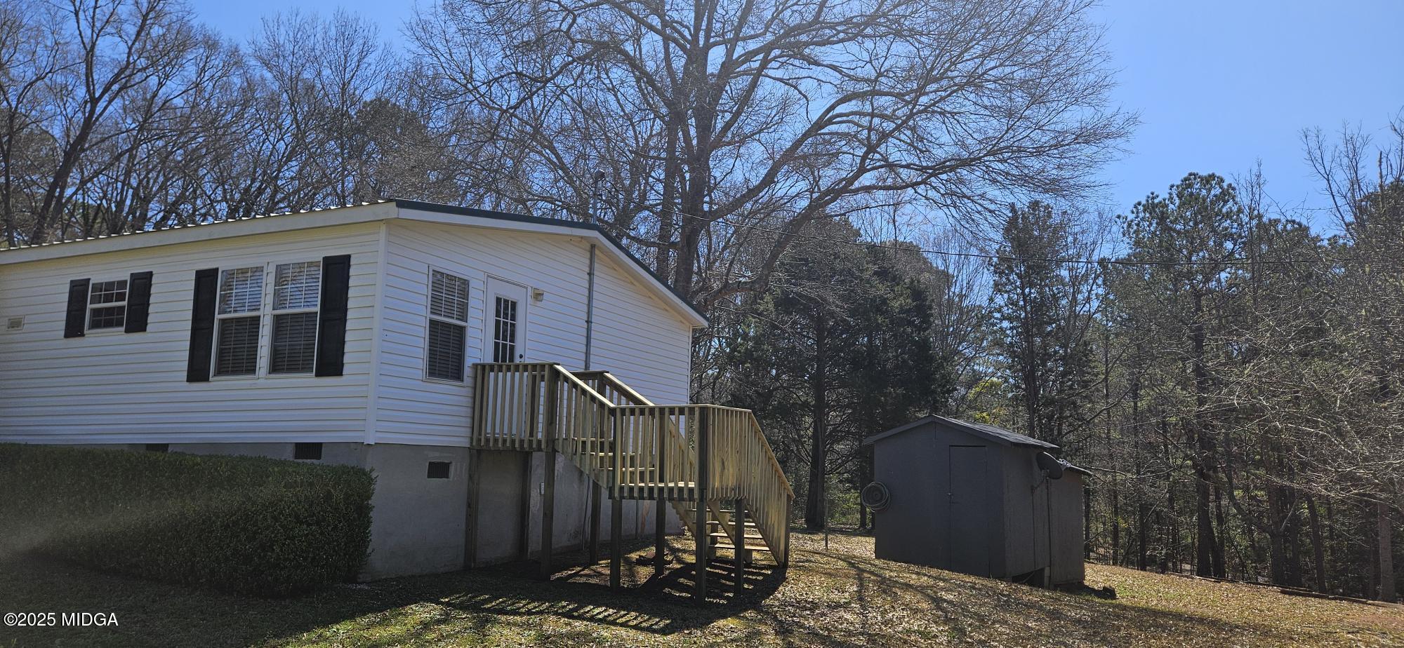 121 5 Points Road Gray, GA 31032 - Photo 7 of 20 a front view of a house with trees