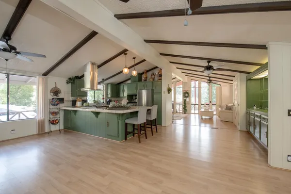 a view of room with window and wooden floor