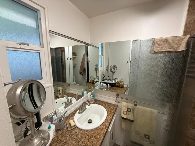 a bathroom with a sink and mirror