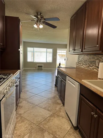 a kitchen with a sink cabinets and stainless steel appliances