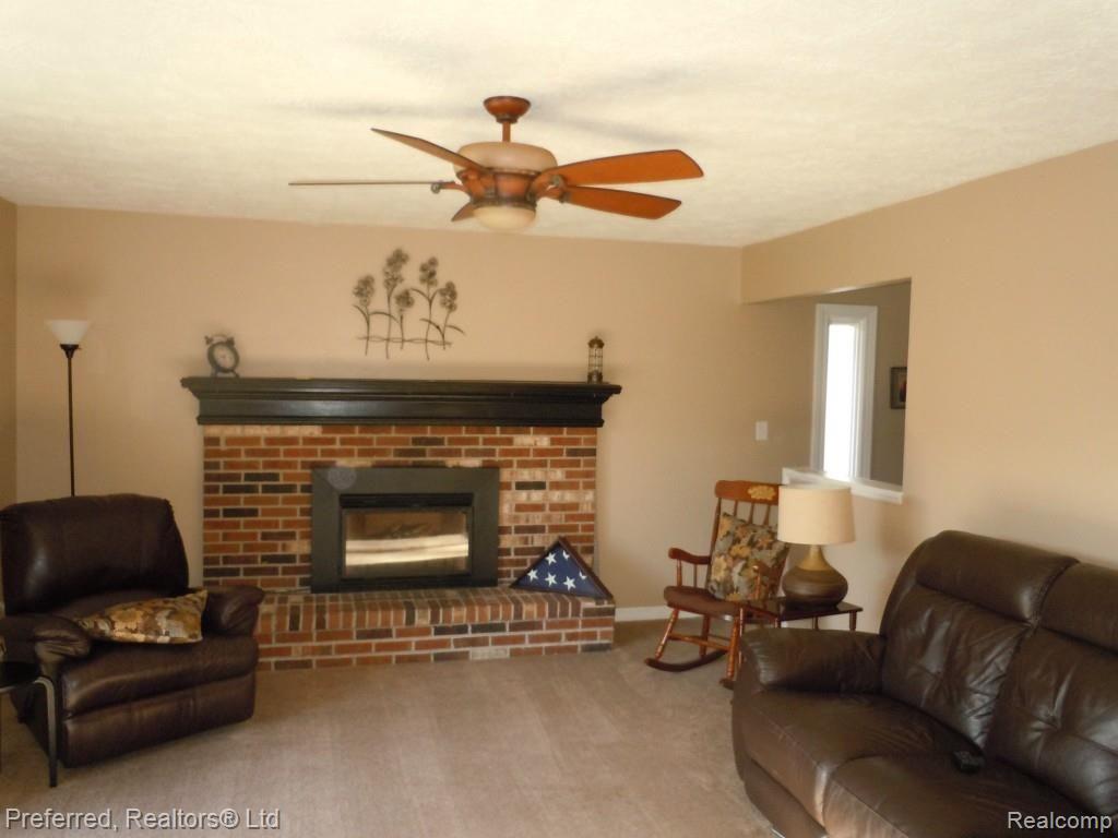 8334 Mannington Road Canton, MI 48187 - Photo 15 of 26 FAMILY ROOM W/REMOTE GAS FIREPLACE INSERT