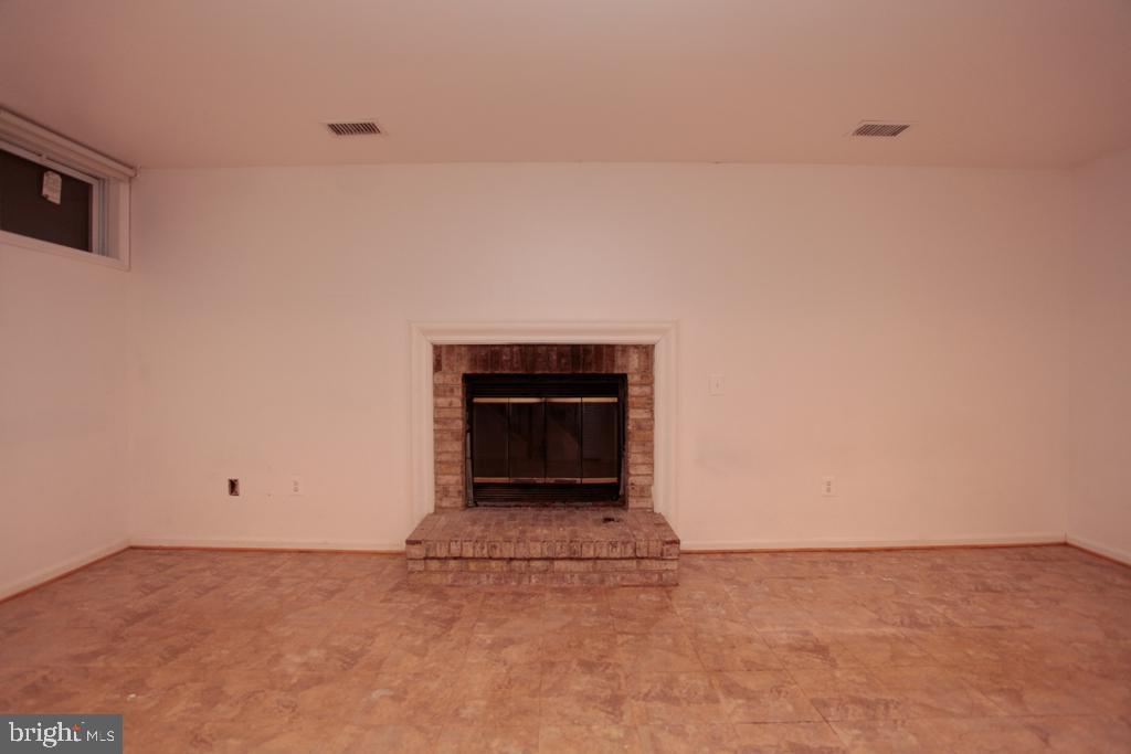 109 Finale Terrace Silver Spring, MD 20901 - Photo 84 of 100 Rec Room with Wood Burning Fire Place