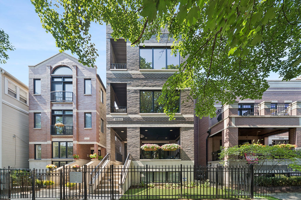 a front view of house with yard and outdoor seating
