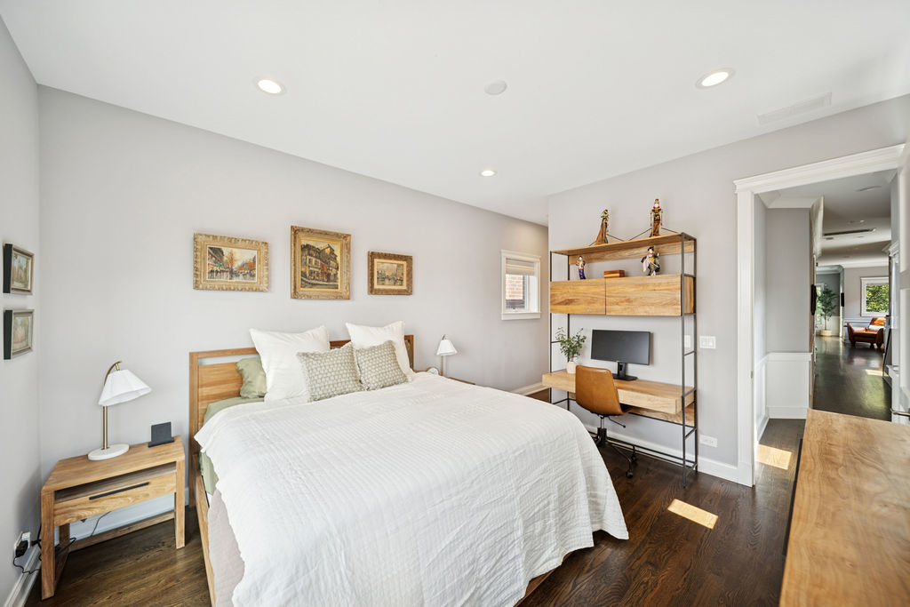 3044 North Racine Avenue, Unit 3 Chicago, IL 60657 - Photo 12 of 29 a bedroom with a bed and wooden floor