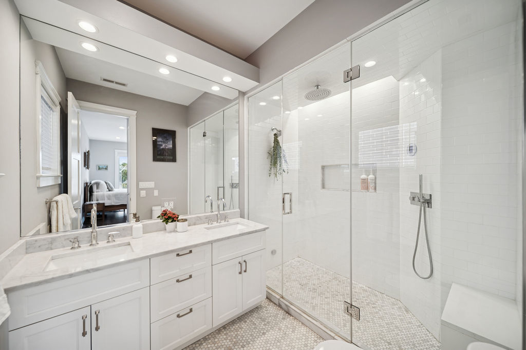 3044 North Racine Avenue, Unit 3 Chicago, IL 60657 - Photo 13 of 29 a bathroom with a double vanity sink toilet and shower