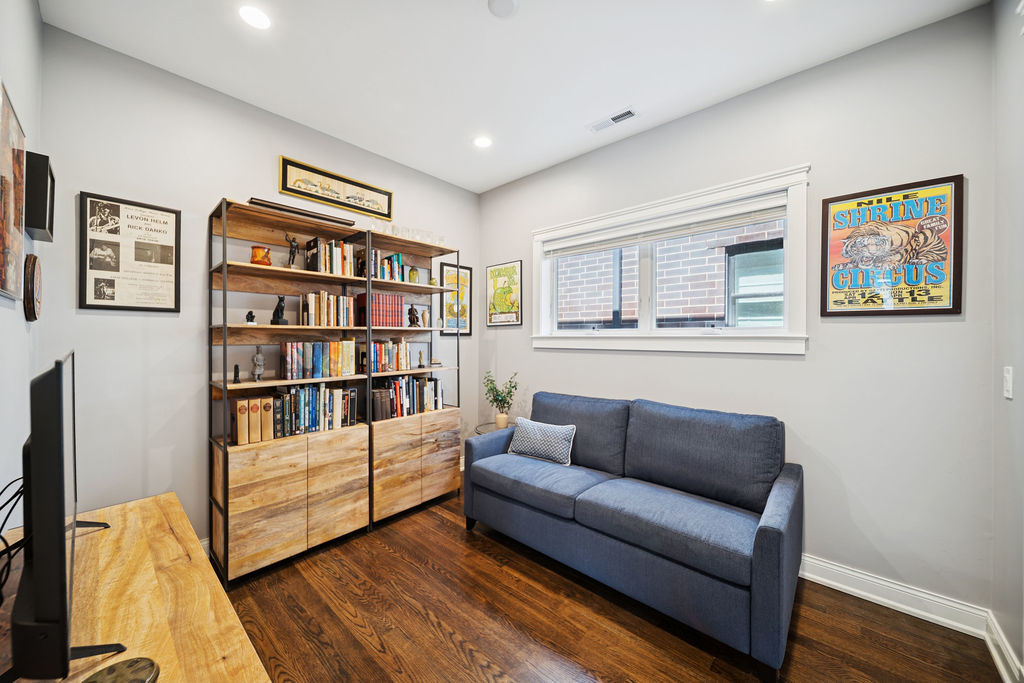3044 North Racine Avenue, Unit 3 Chicago, IL 60657 - Photo 15 of 29 a living room with furniture and a book shelf