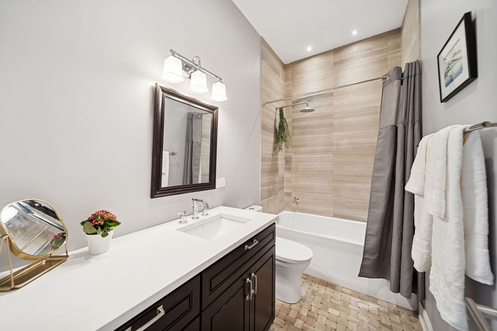 3044 North Racine Avenue, Unit 3 Chicago, IL 60657 - Photo 17 of 29 a bathroom with a granite countertop sink toilet and shower