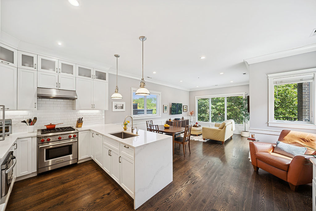 3044 North Racine Avenue, Unit 3 Chicago, IL 60657 - Photo 2 of 29 a kitchen with stainless steel appliances granite countertop a stove and a wooden floors