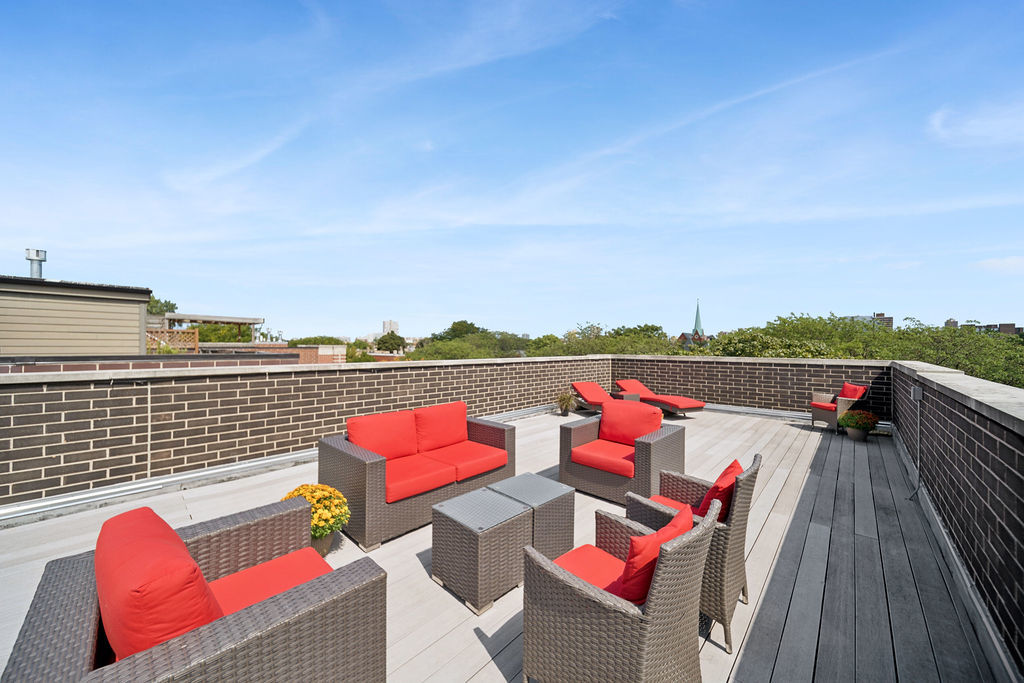 3044 North Racine Avenue, Unit 3 Chicago, IL 60657 - Photo 23 of 29 an outdoor sitting area with furniture and a lake view