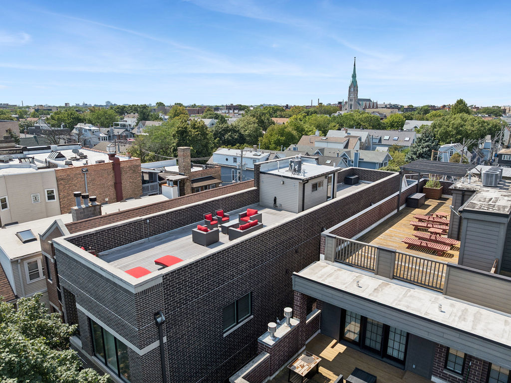 3044 North Racine Avenue, Unit 3 Chicago, IL 60657 - Photo 26 of 29 a view of roof deck with two chairs and a dining table