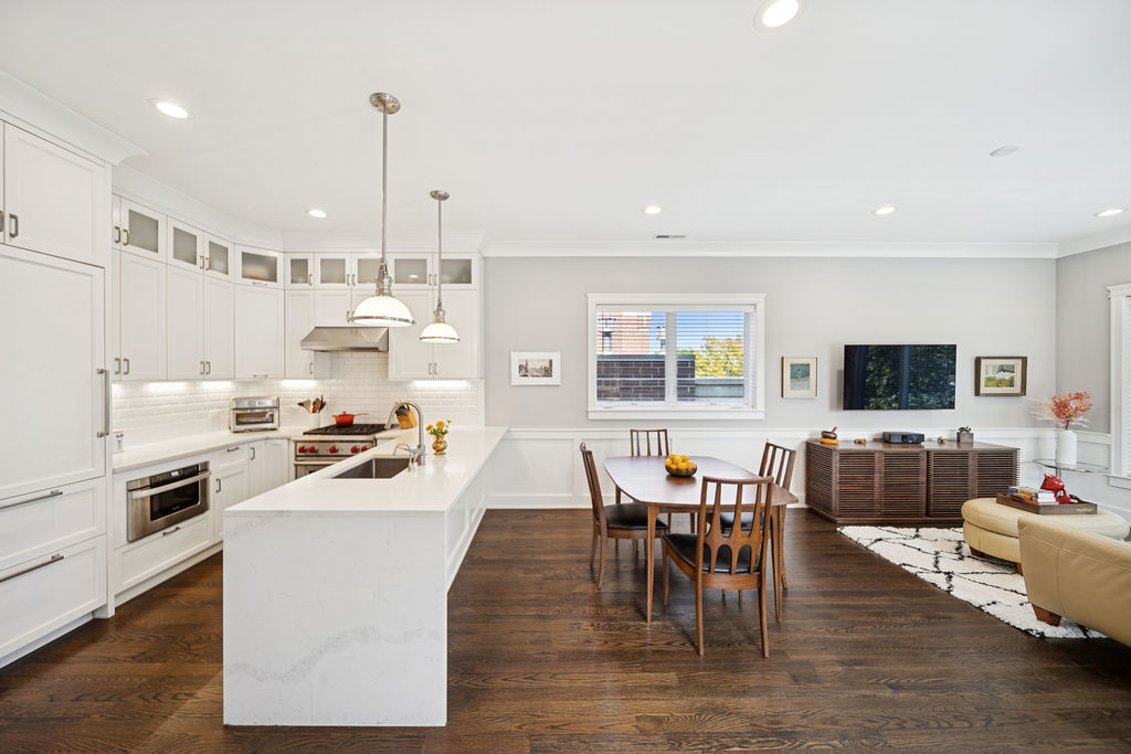 3044 North Racine Avenue, Unit 3 Chicago, IL 60657 - Photo 3 of 29 a living room with kitchen island furniture a dining table and a stove top oven