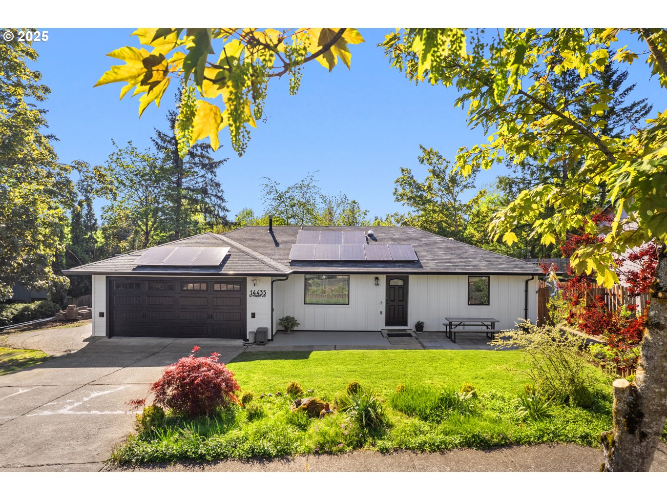14435 Southwest Yearling Way Beaverton, OR 97008 - Photo 1 of 47 a front view of a house with a yard and potted plants