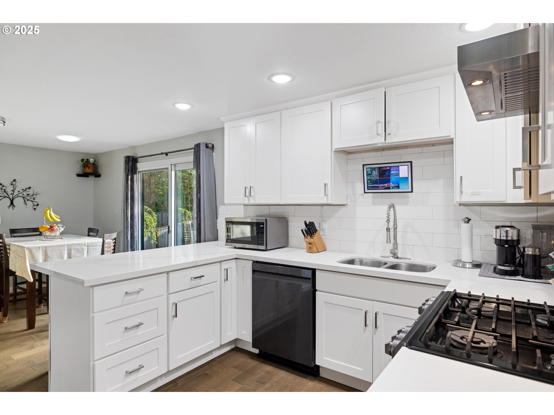 14435 Southwest Yearling Way Beaverton, OR 97008 - Photo 11 of 47 a kitchen with a sink stove and cabinets