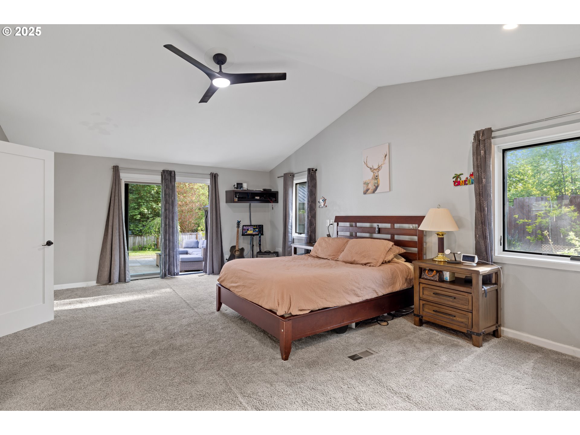 14435 Southwest Yearling Way Beaverton, OR 97008 - Photo 20 of 47 a spacious bedroom with a bed and a large window