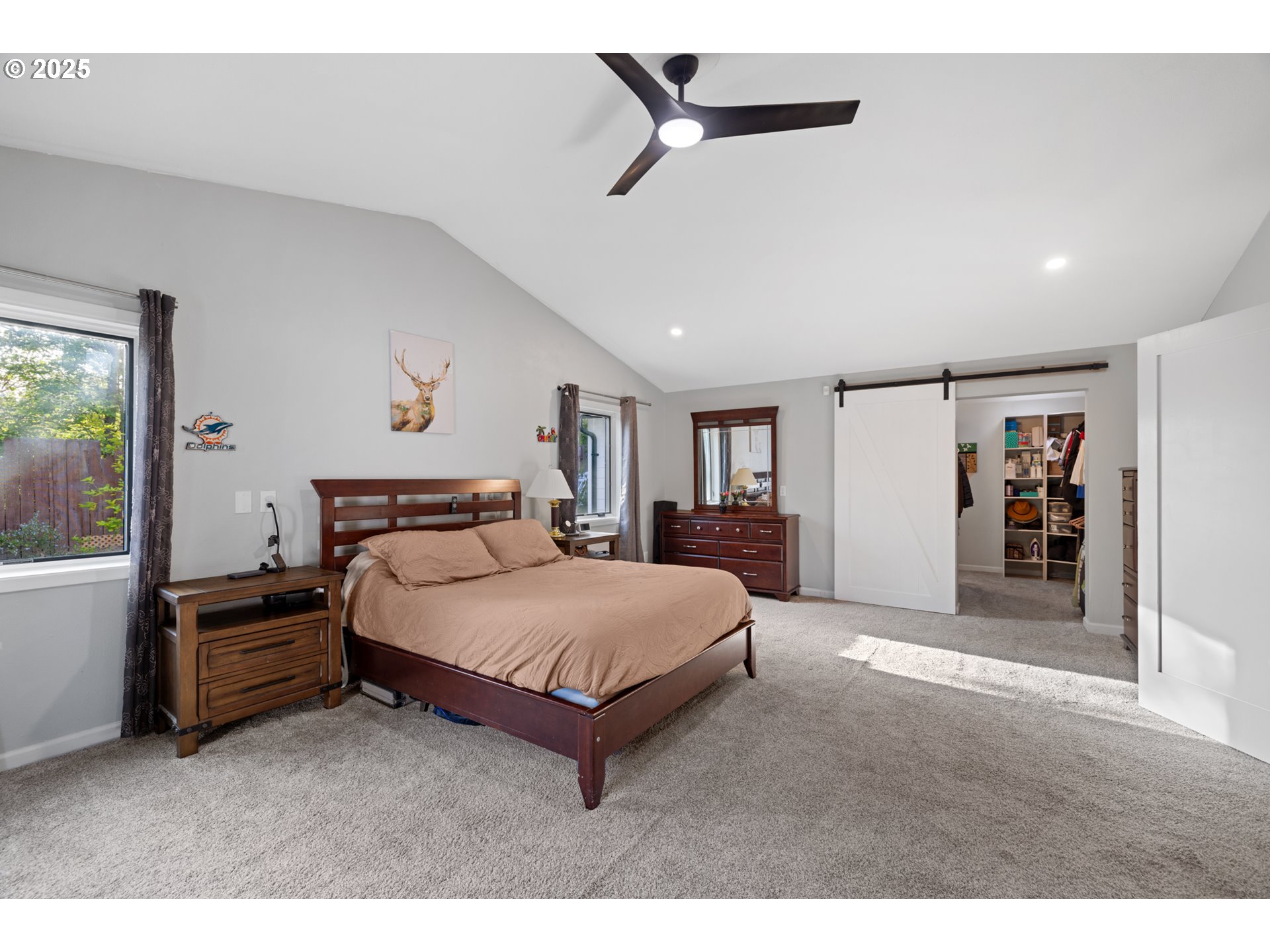 14435 Southwest Yearling Way Beaverton, OR 97008 - Photo 22 of 47 a spacious bedroom with a bed and a large mirror