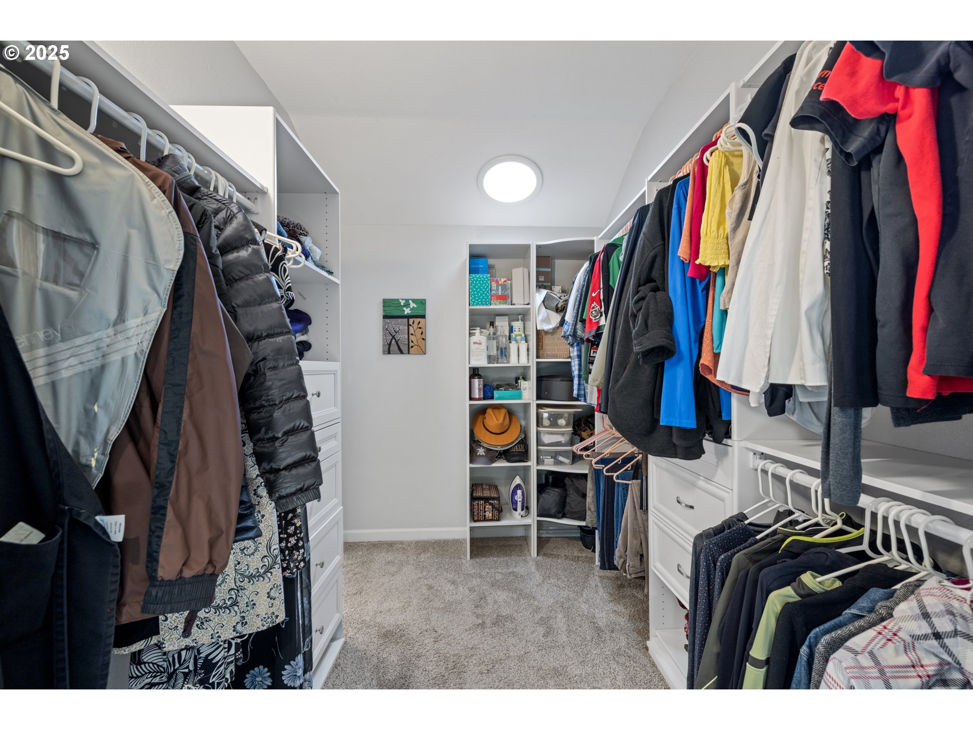 14435 Southwest Yearling Way Beaverton, OR 97008 - Photo 25 of 47 a view of walk in closet with clothes and shoes